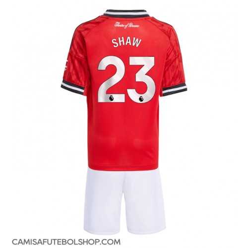 Camisa de time de futebol Manchester United Luke Shaw #23 Replicas 1º Equipamento Infantil 2025-26 Manga Curta (+ Calças curtas)